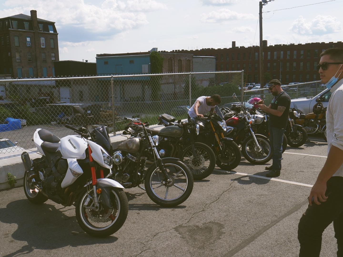 Motorcycles lined up outside of New Tradition Co.