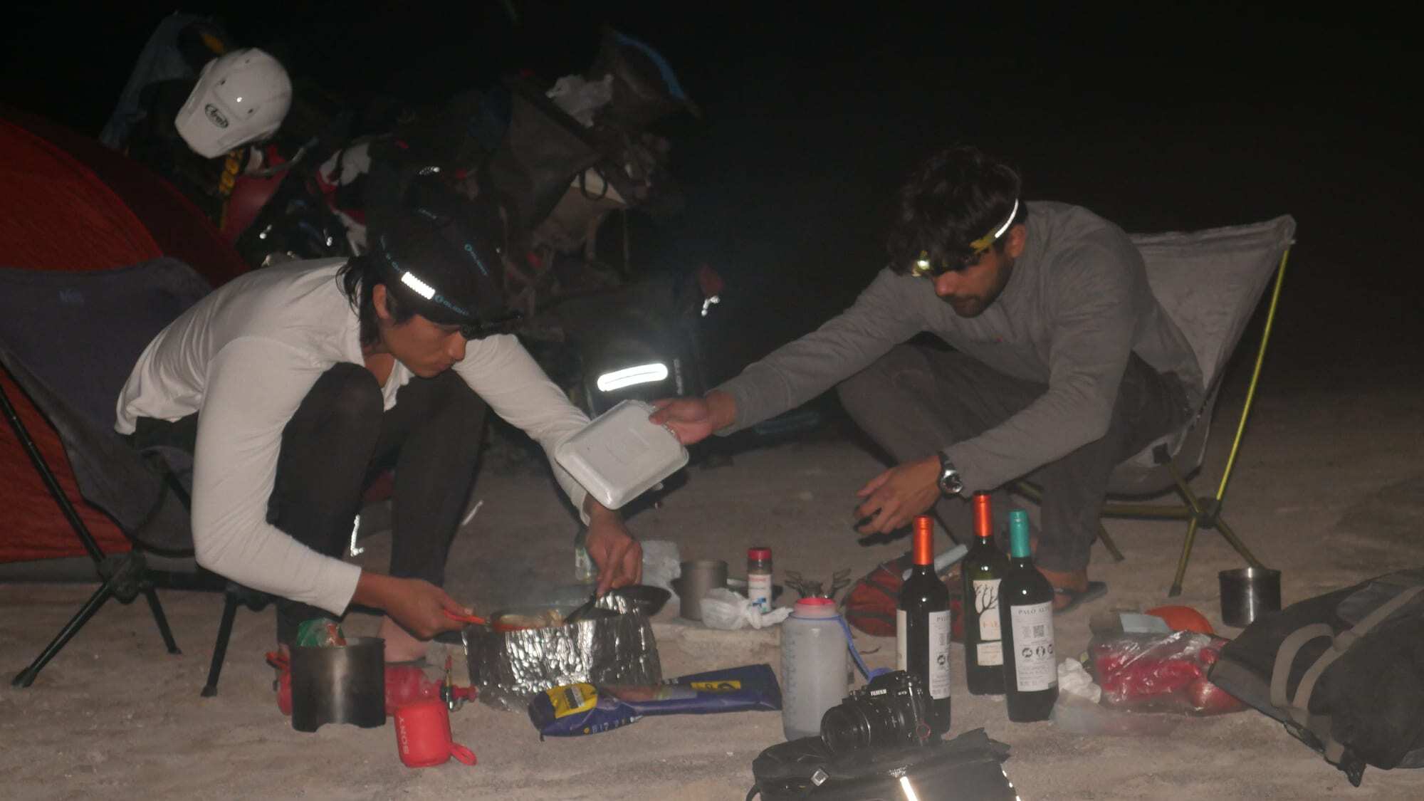 Preparing dinner at a beach campsite