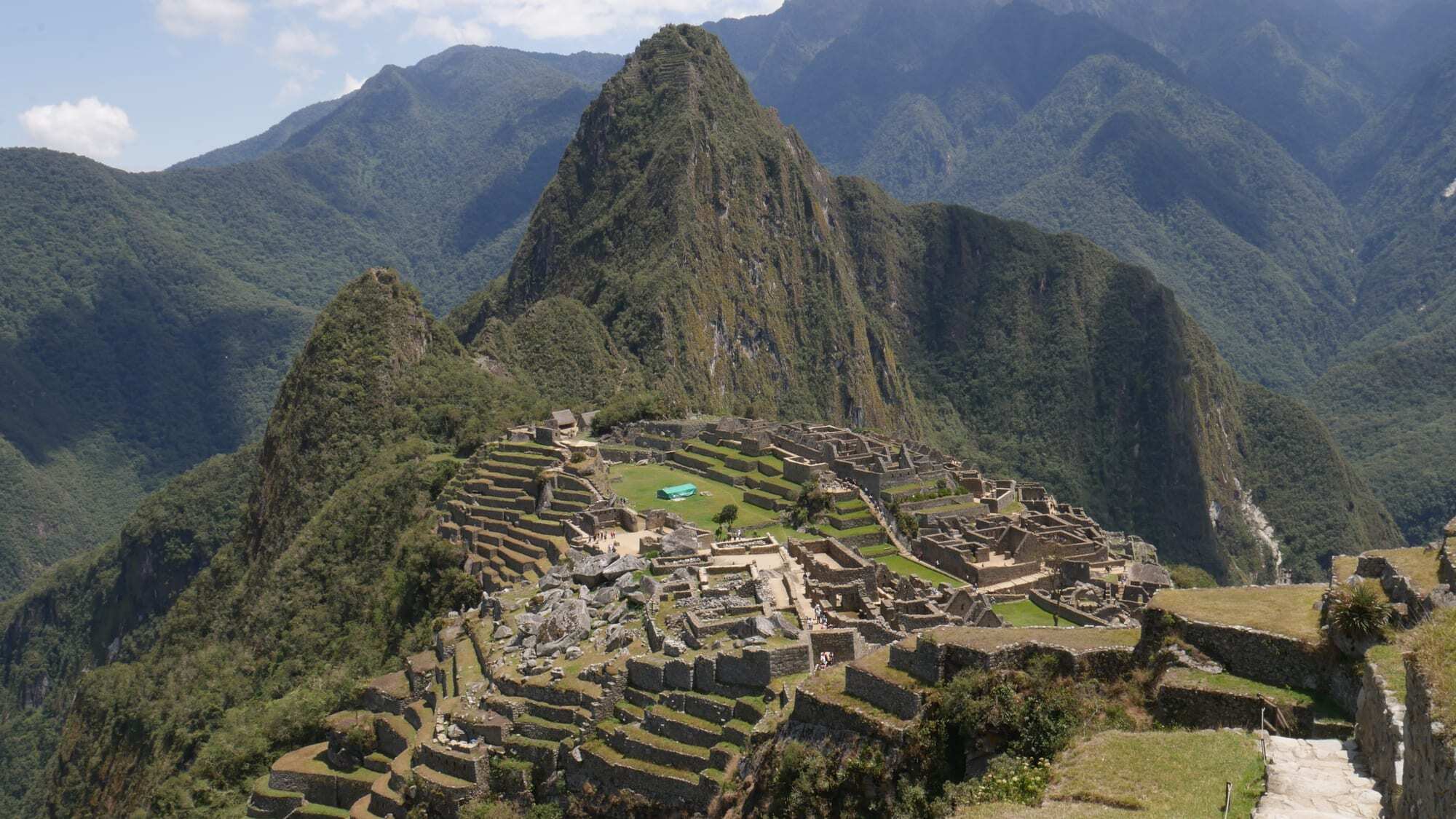 Machu Picchu surrounded by green mountain peaks