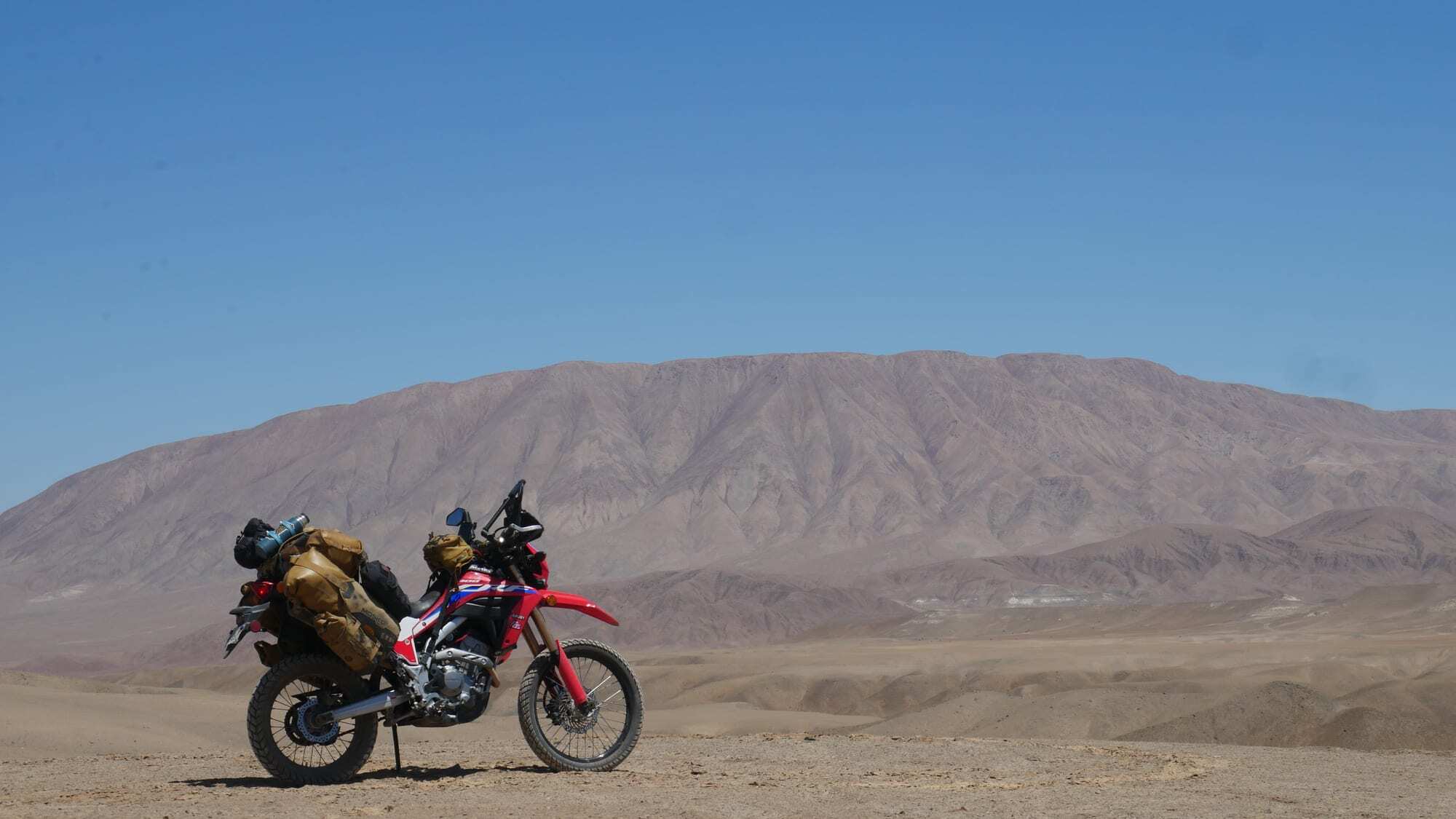 My motorcycle parked in the Peruvian desert